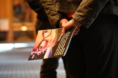 Person holding RM report