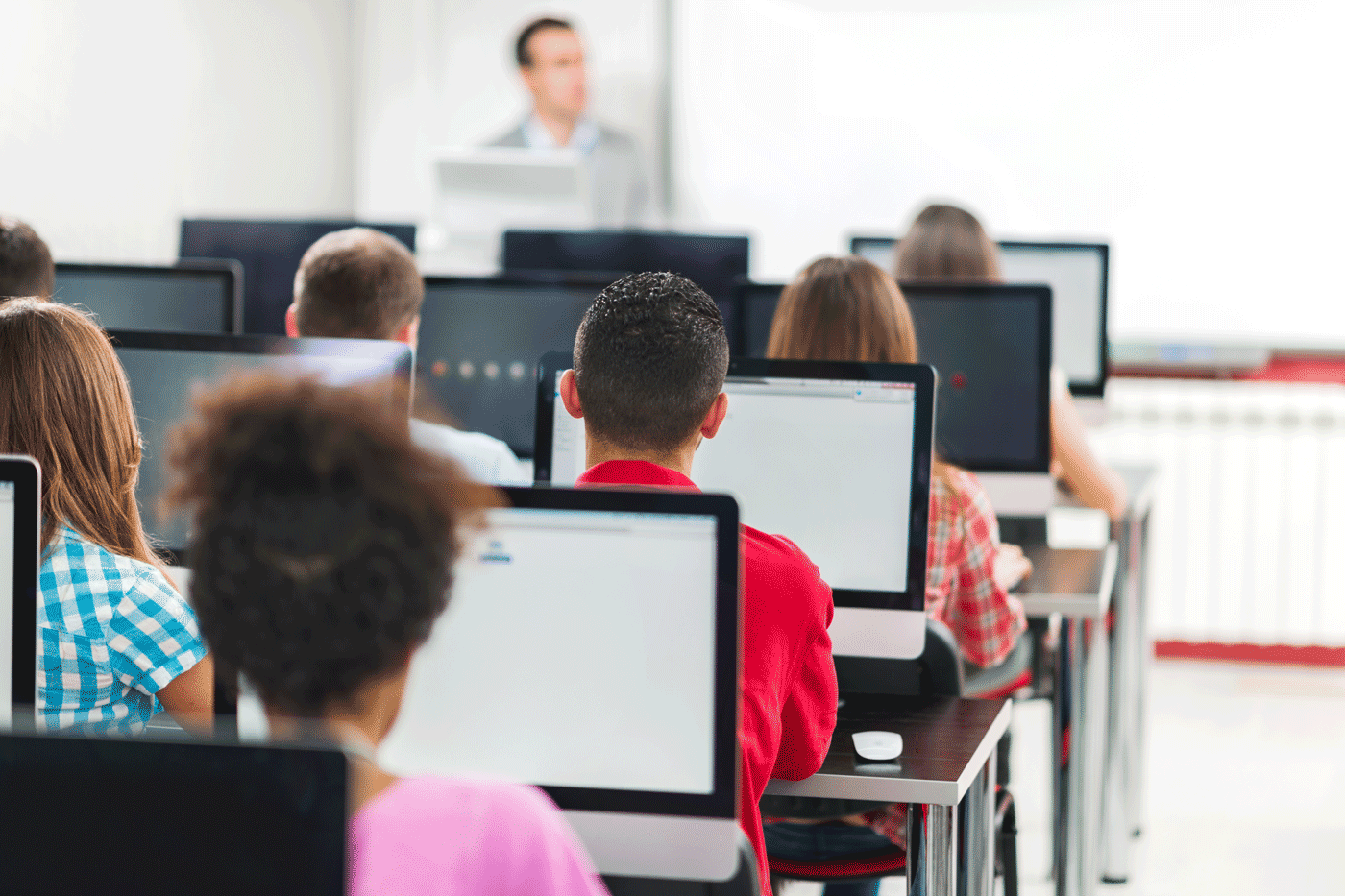 A classroom scene showing students working on computers